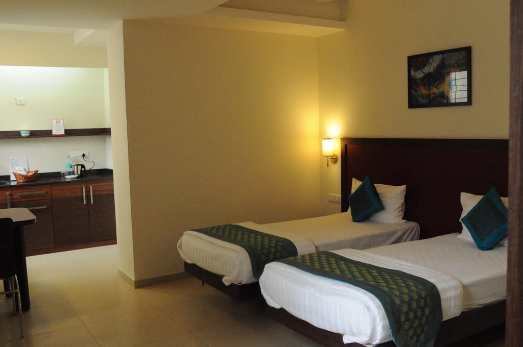 Ixora Suites Bangalore Kamer foto