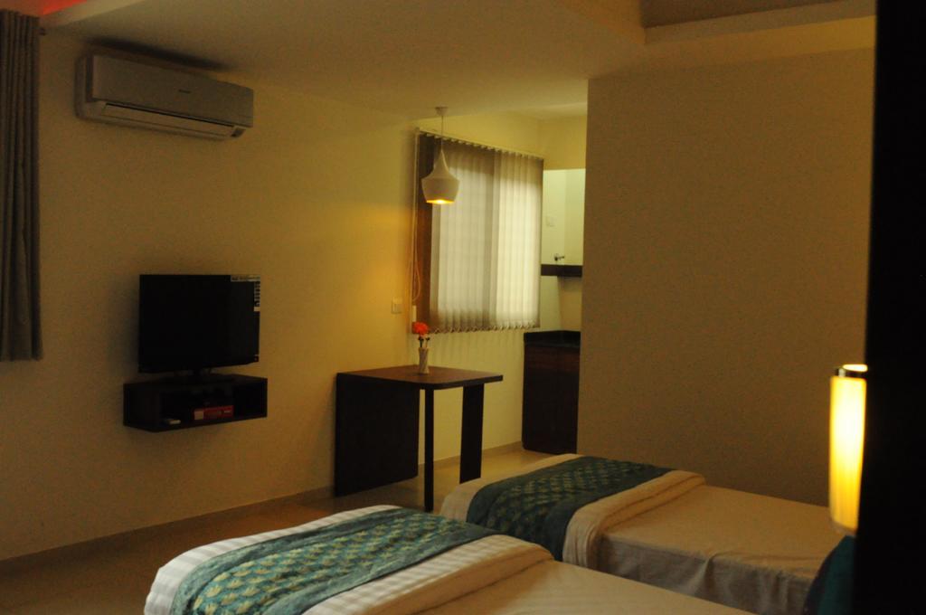 Ixora Suites Bangalore Kamer foto