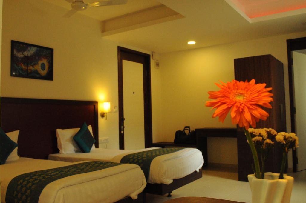 Ixora Suites Bangalore Kamer foto