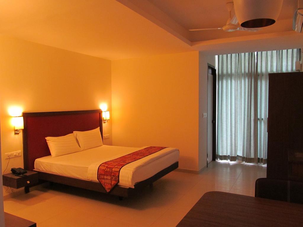 Ixora Suites Bangalore Kamer foto