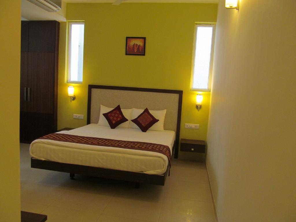 Ixora Suites Bangalore Kamer foto